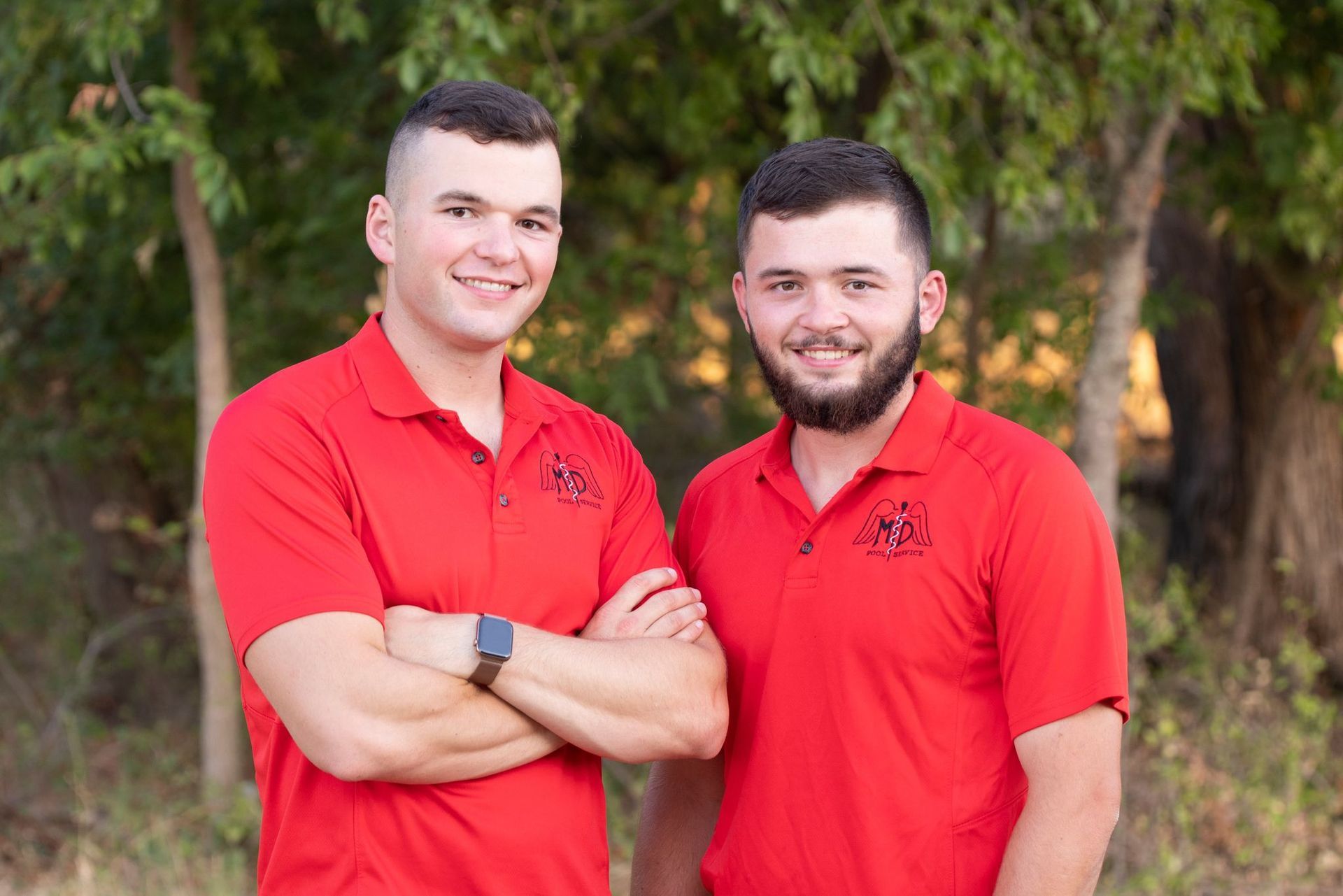 MD Pool Service team members in red polo shirts